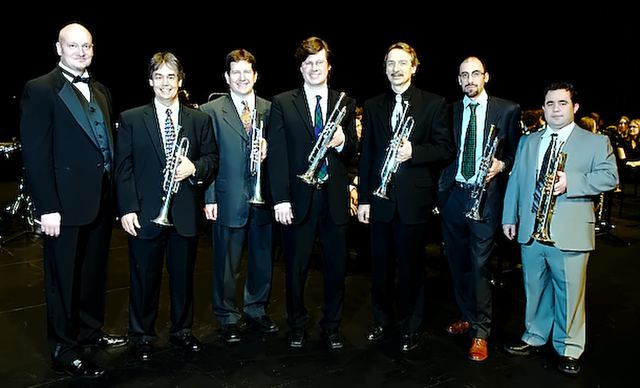 Trumpet section in concert dress on stage
