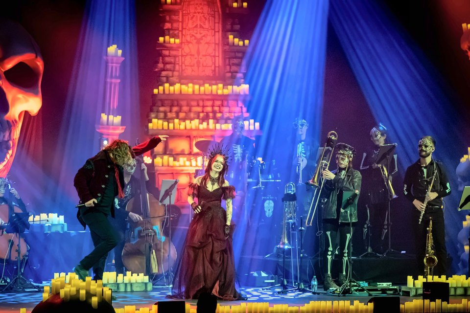 The Rock Orchestra by Candlelight on stage among candles and skull scenery