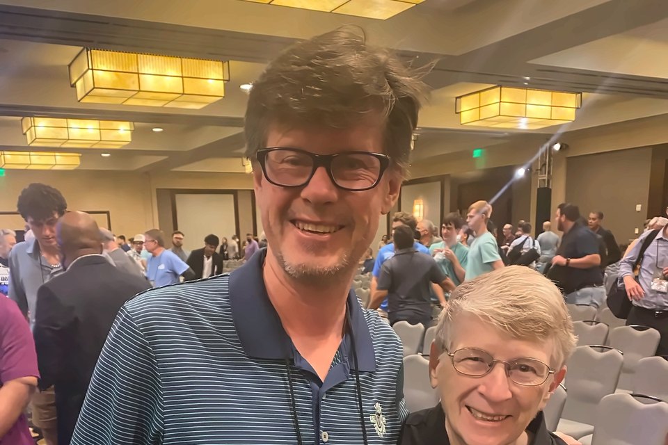 Luis Engelke with trumpeter Susan Slaughter at a conference